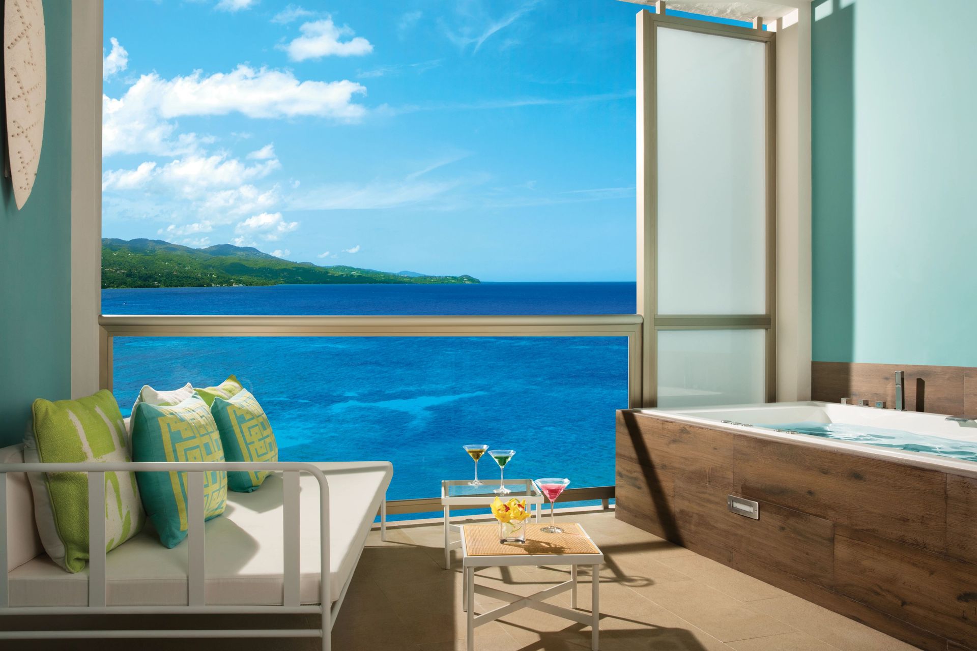 Oceanview suite with tub and drinks at Breathless Montego Bay 