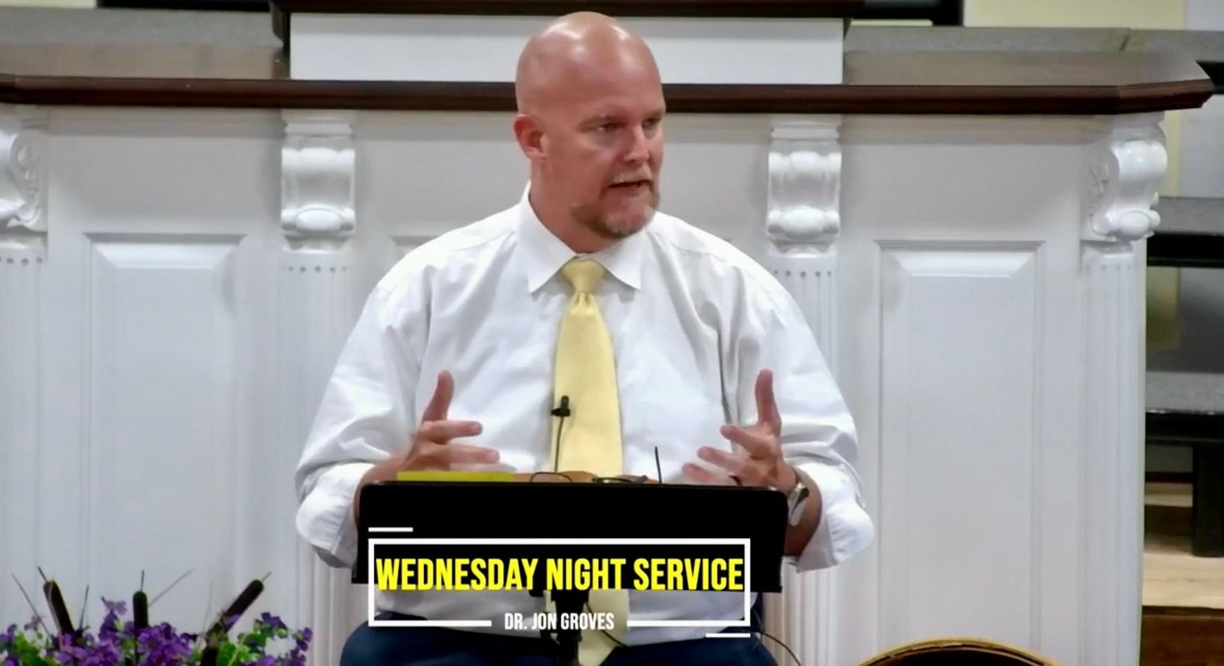 Pastor Jon Groves teaching at a Wednesday night service