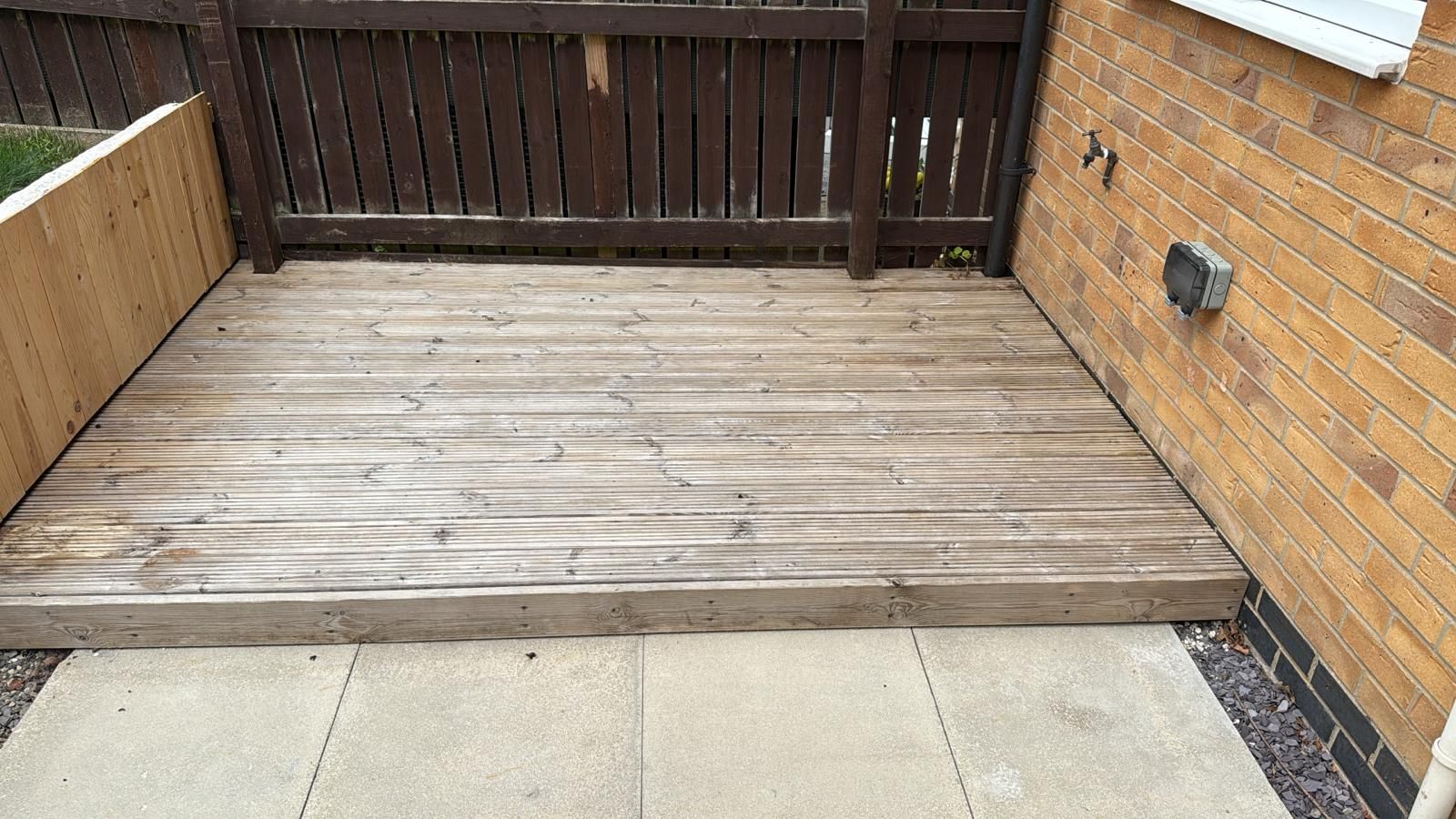 Softwood timber decking after cleaning and biocide application, showing no organic growth