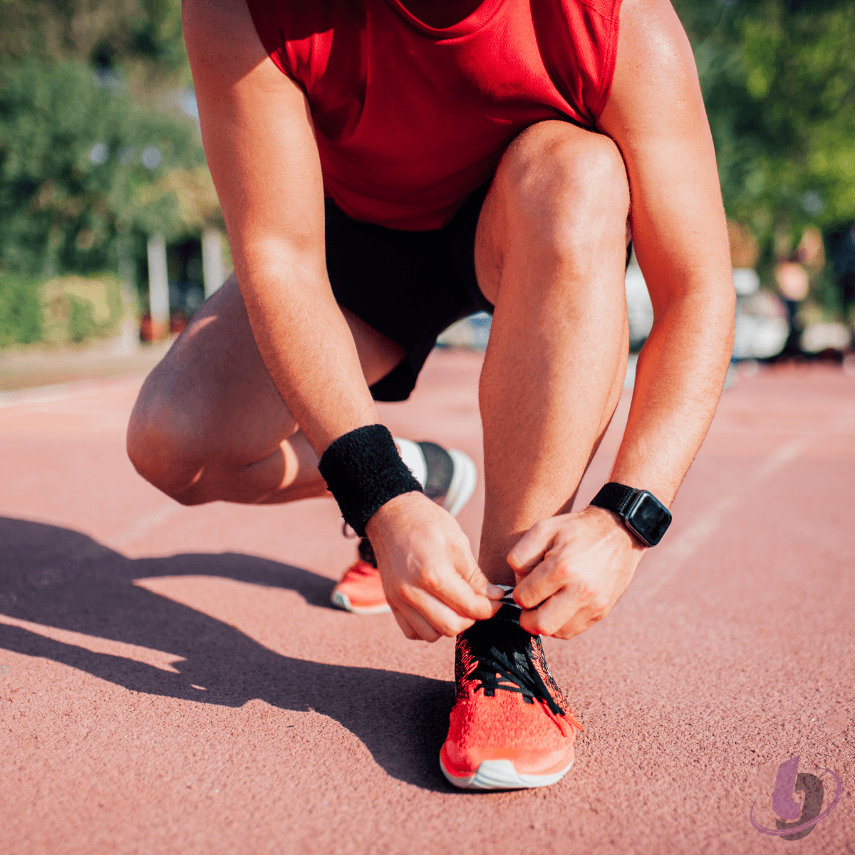 Male athlete tying his shoe