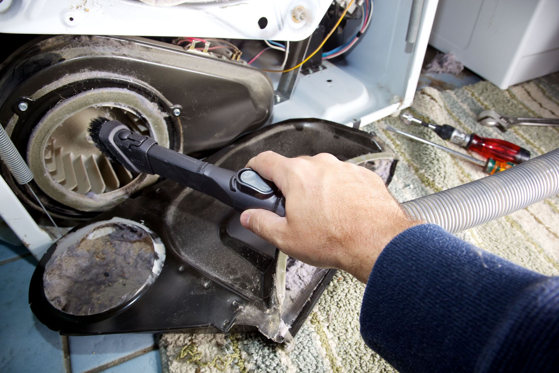 technician cleaning dryer blower wheel & vent technician cleaning dryer blower wheel & vent
