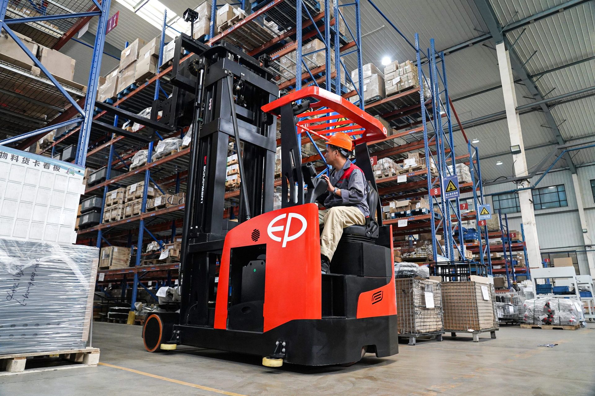 Reach truck in warehouse racking