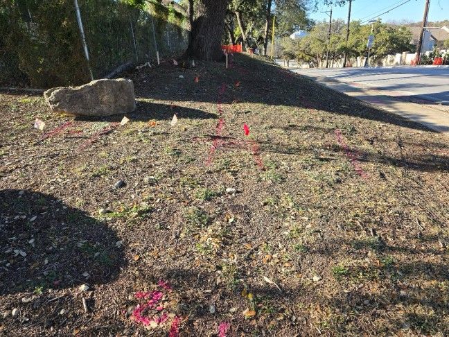 SiteTwin technician marking utility locate flags before excavation on a Texas jobsite
