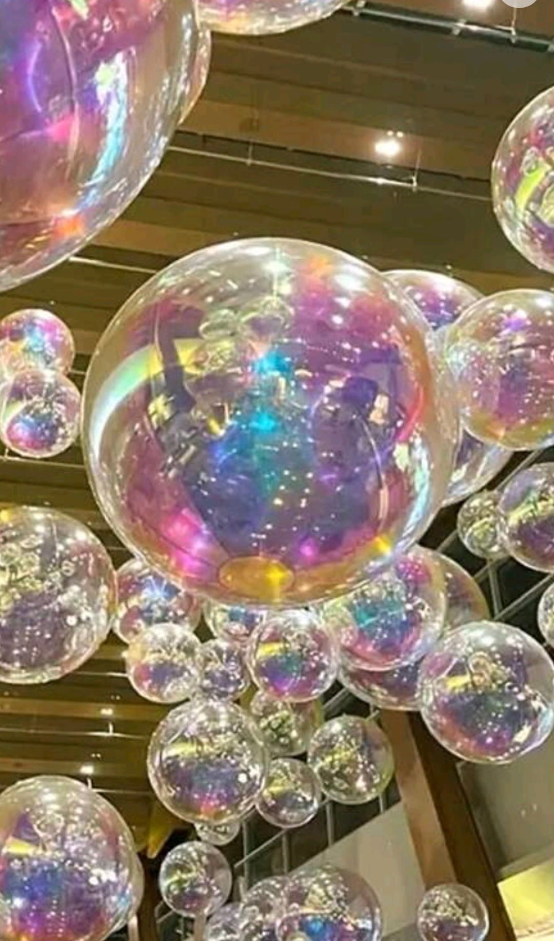 blurred symphonic orchestra on stage with lots of candles