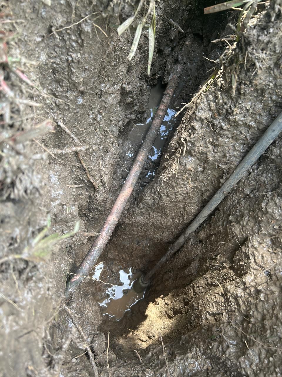 Buried utility exposed by potholing to verify location before directional boring
