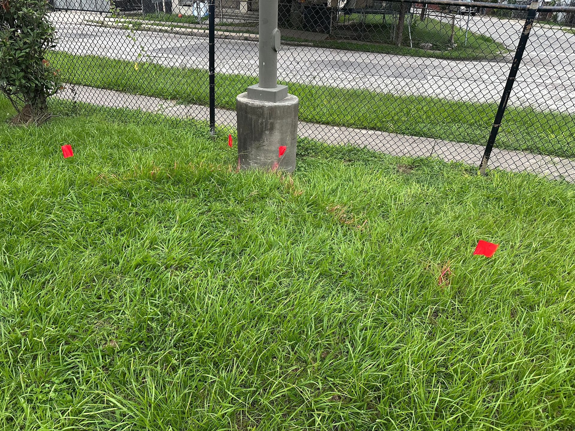 Utility locating at a school campus in Round Rock, TX with marked underground utilities before construction