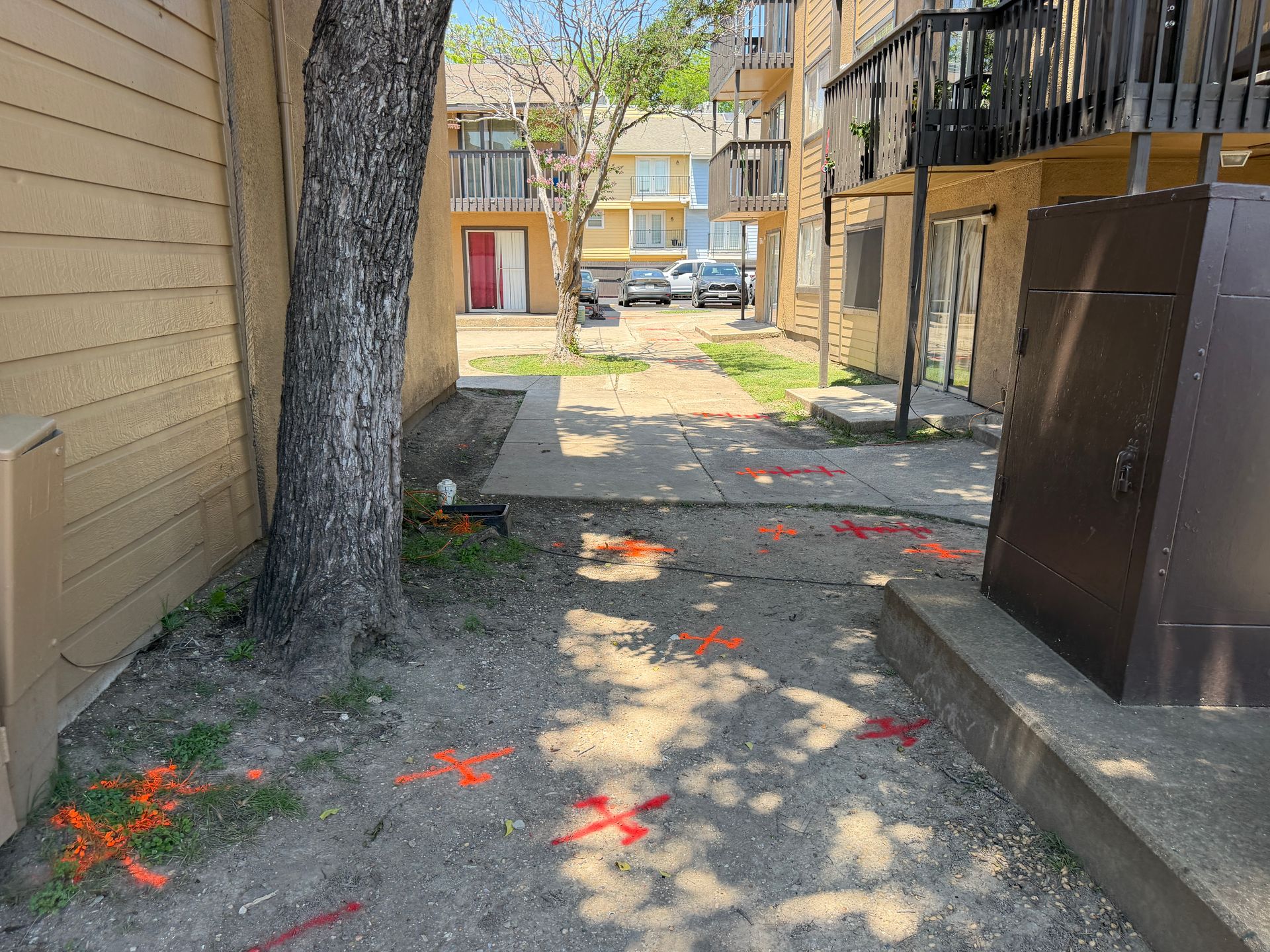 Utility locating at an apartment building in Dallas, TX before trenching