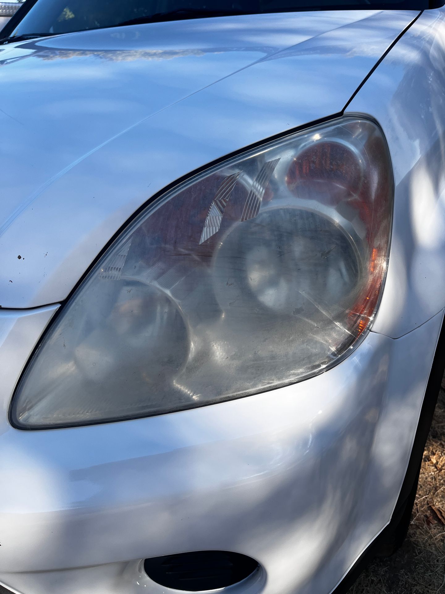 Faded yellow oxidized headlight/before image