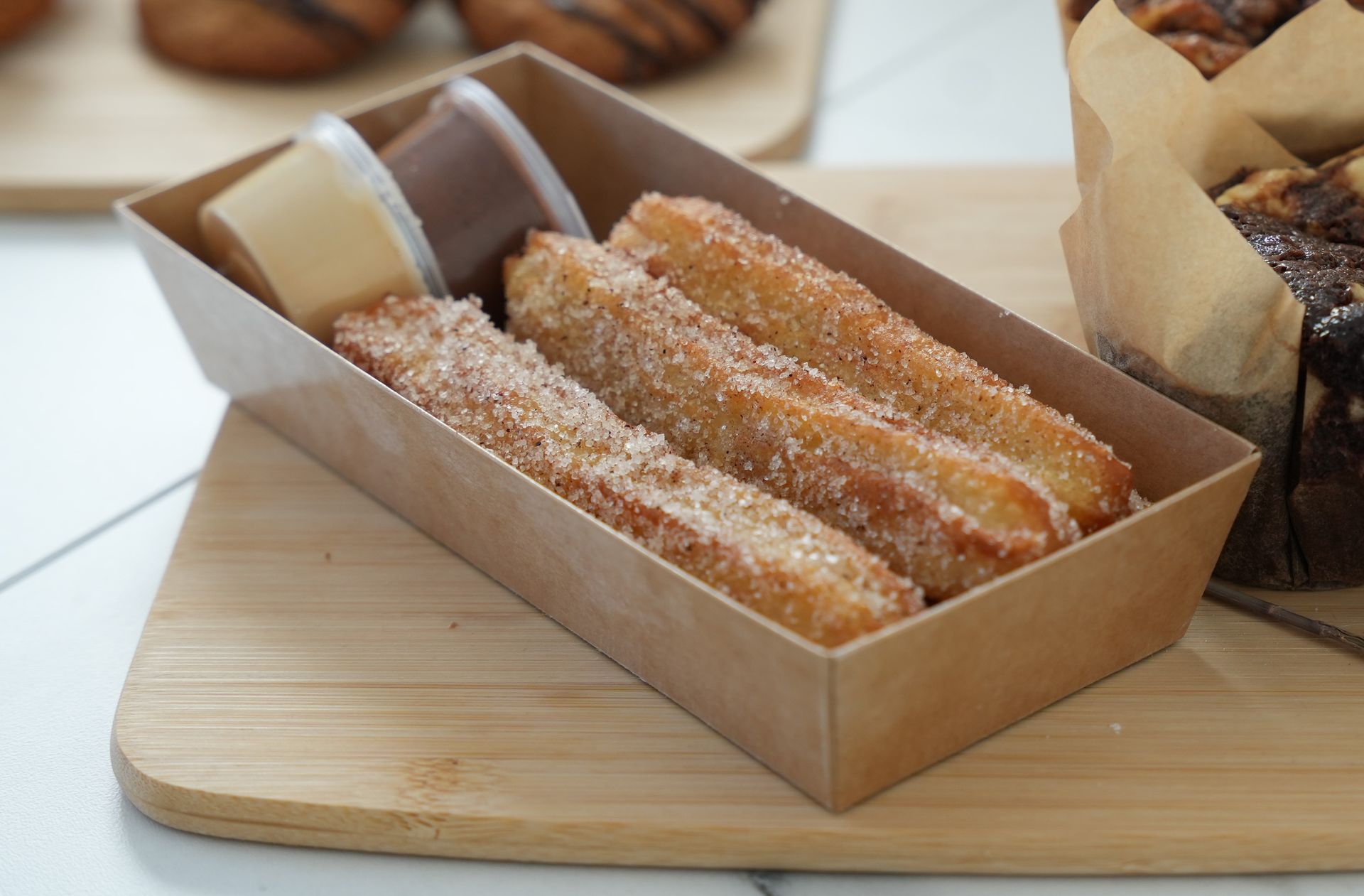 Freshly-fried churros with dipping sauces