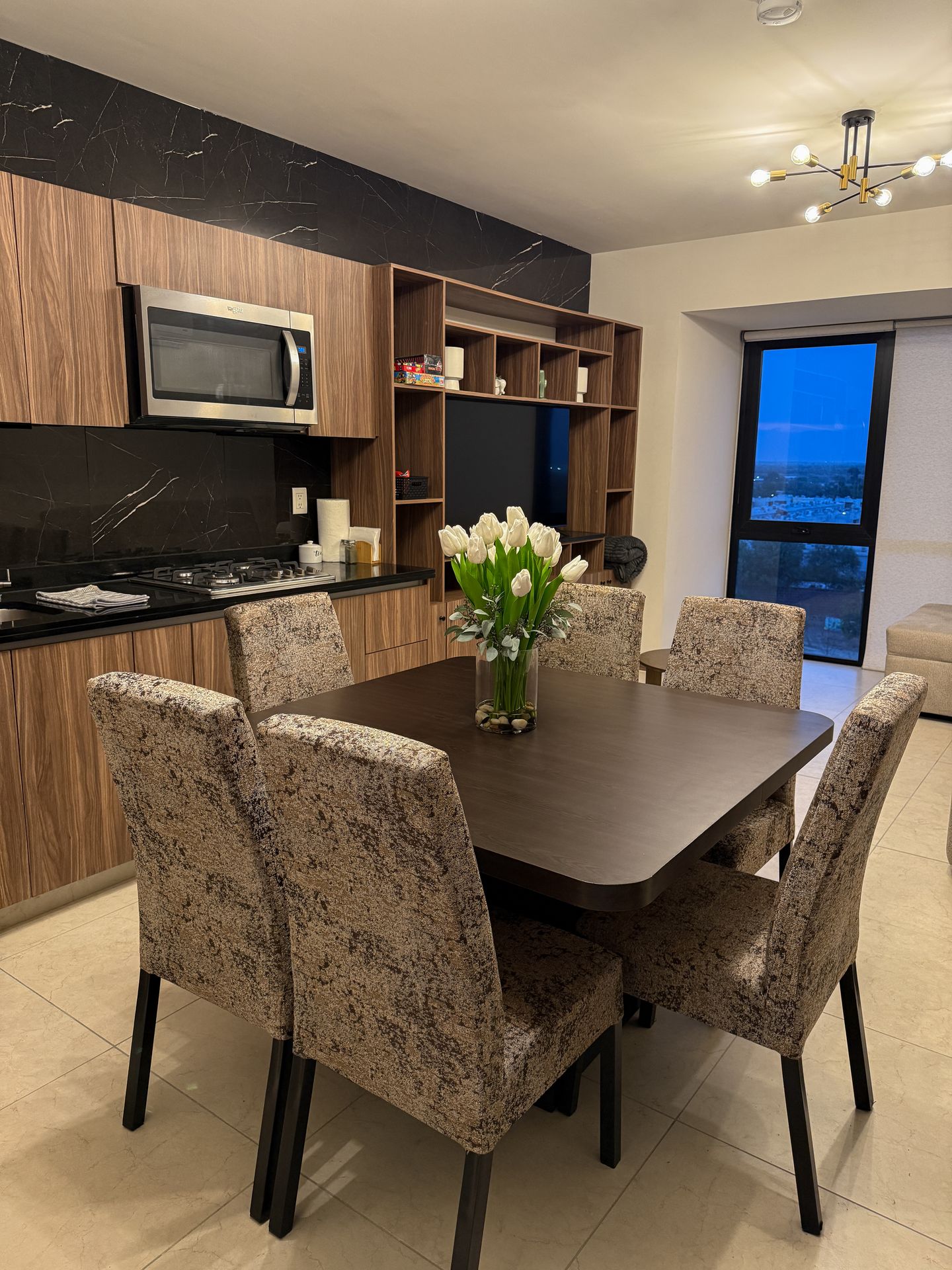 Luxurious contemporary bedroom with city views, premium furnishings, natural light, and modern amenities in upscale apartment