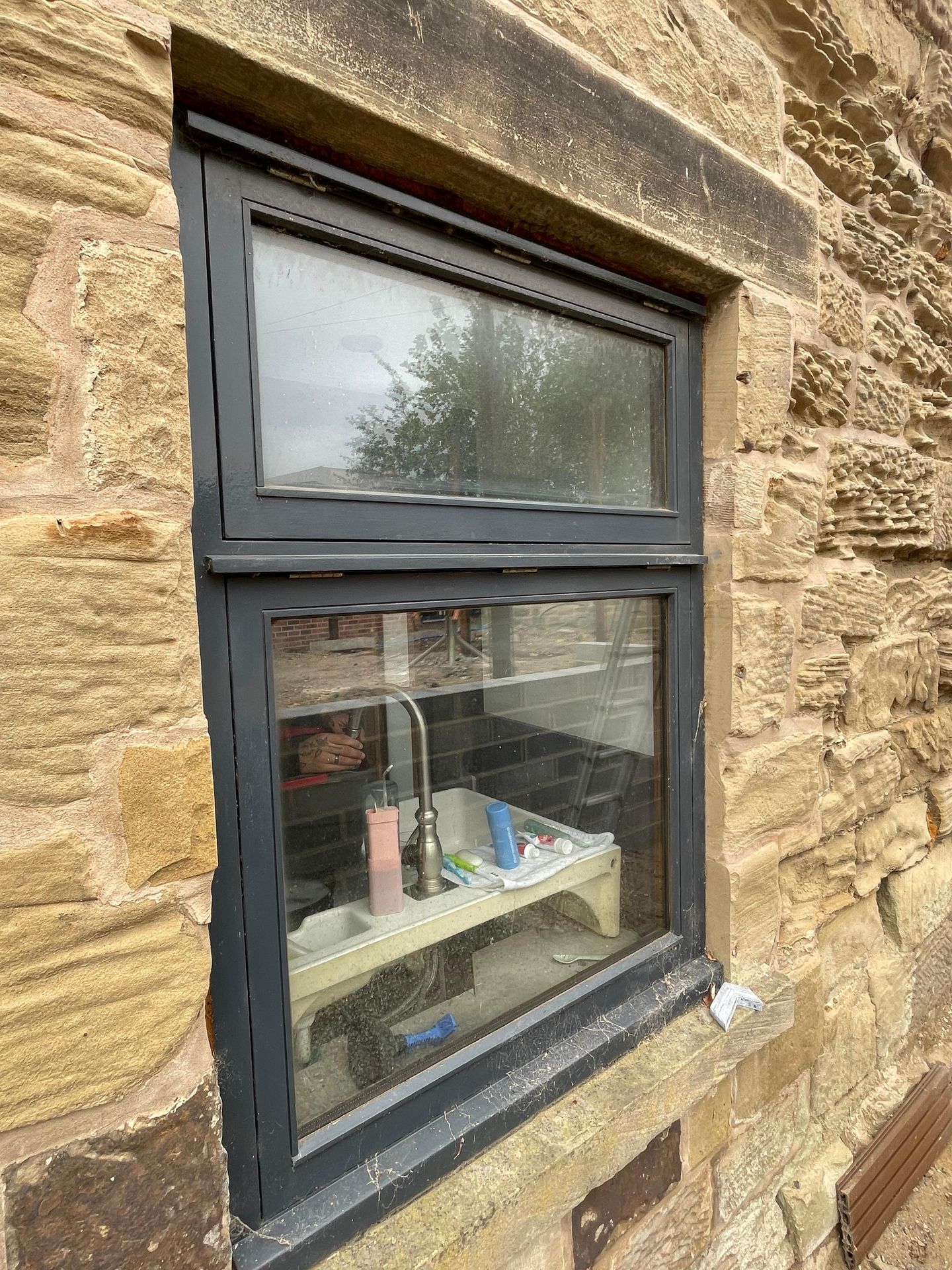 Picture of a window before cleaning, in Pontefract WF8, including dirt and cobwebs