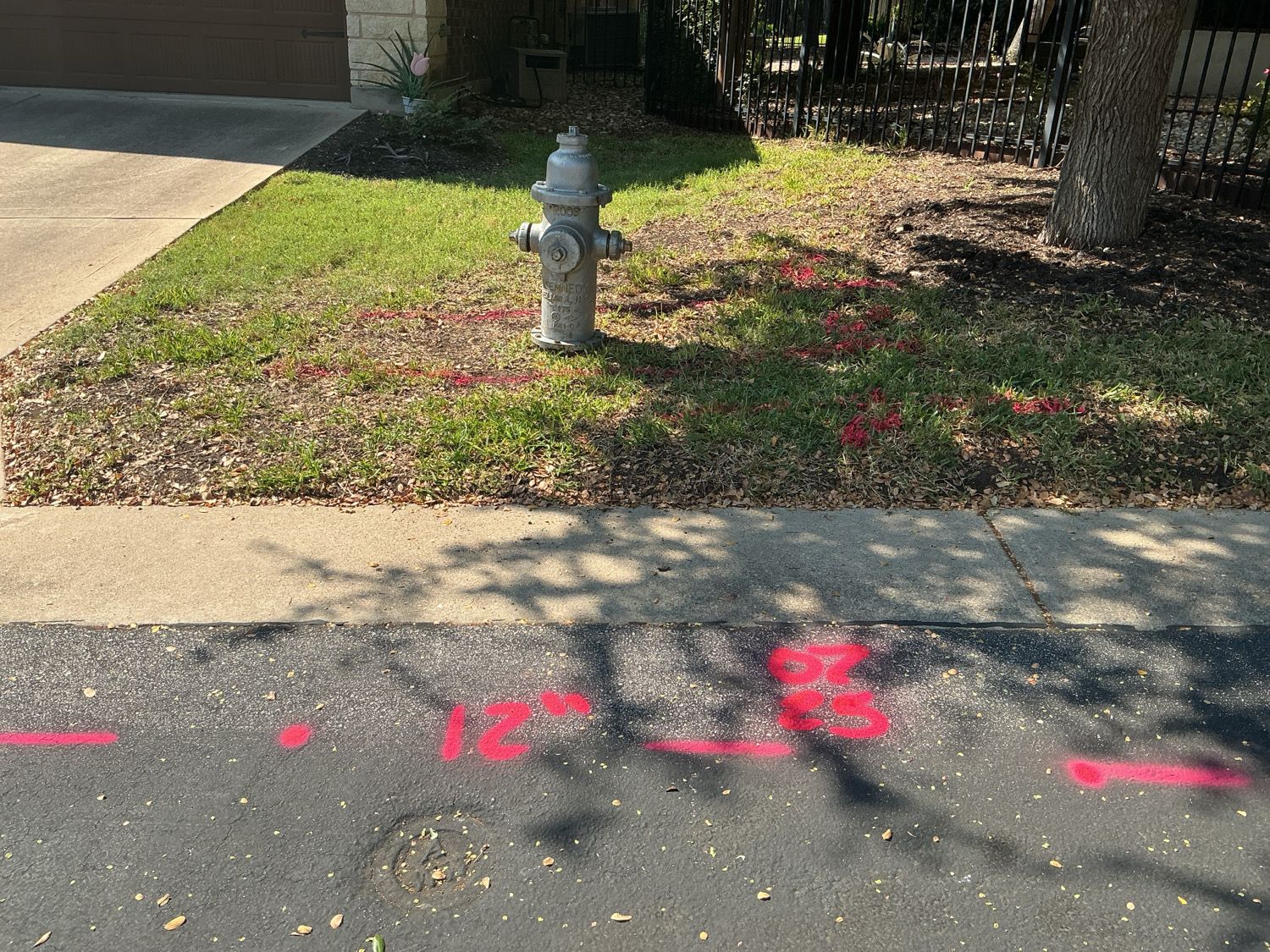 Private utility locating at a multifamily construction site in Austin, TX with marked ground utilities
