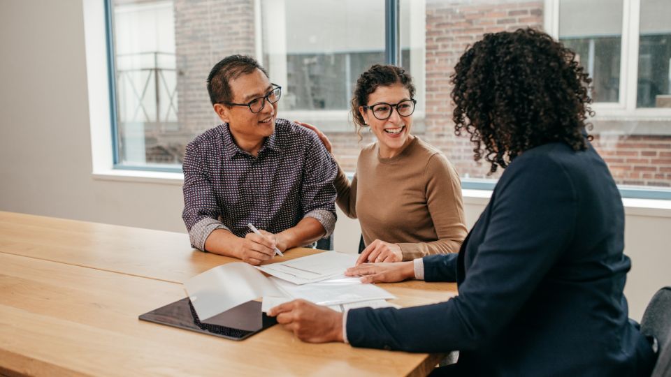 Property professional touring modern apartment with diverse couple during rental inspection and verification process Property professional touring modern apartment with diverse couple during rental inspection and verification process