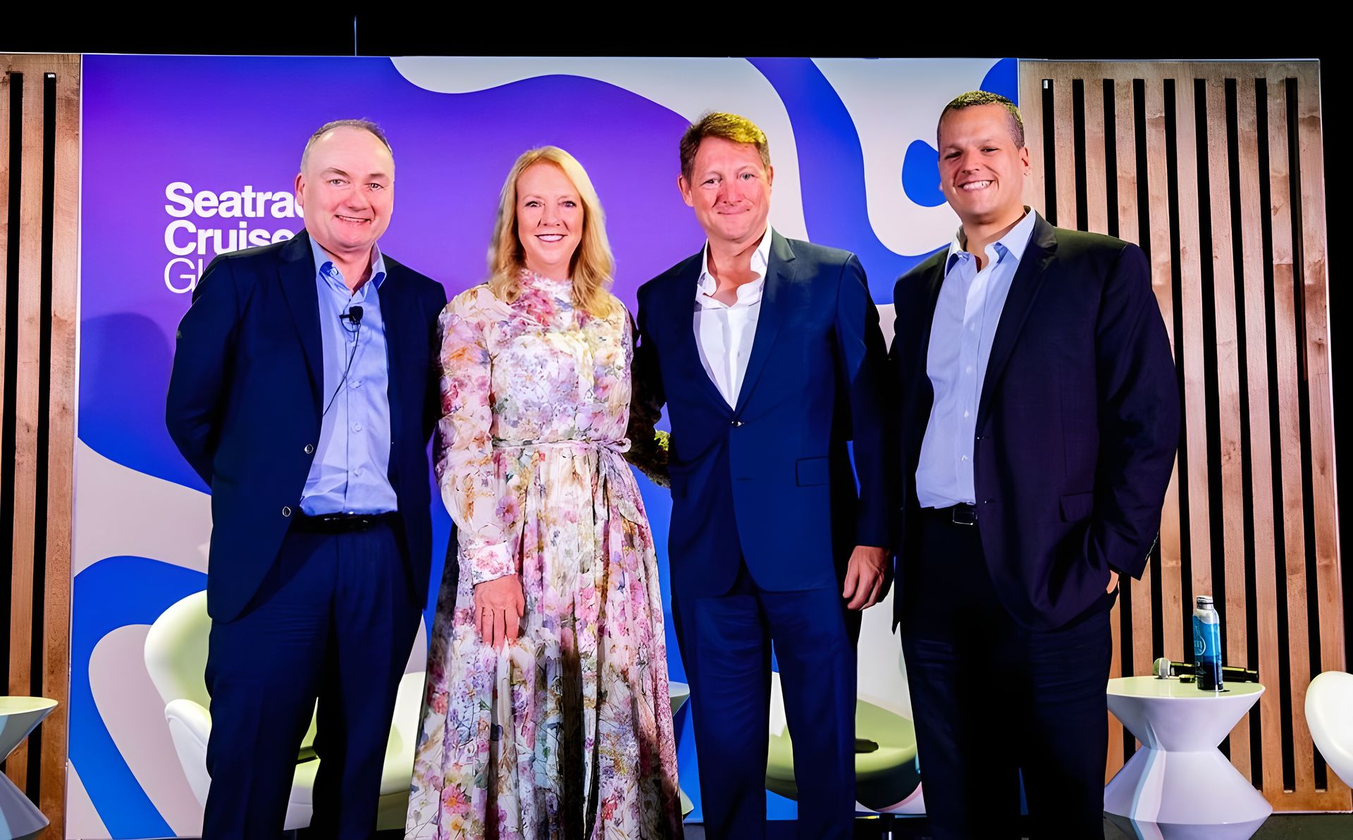 man sitting on red cushion beside window