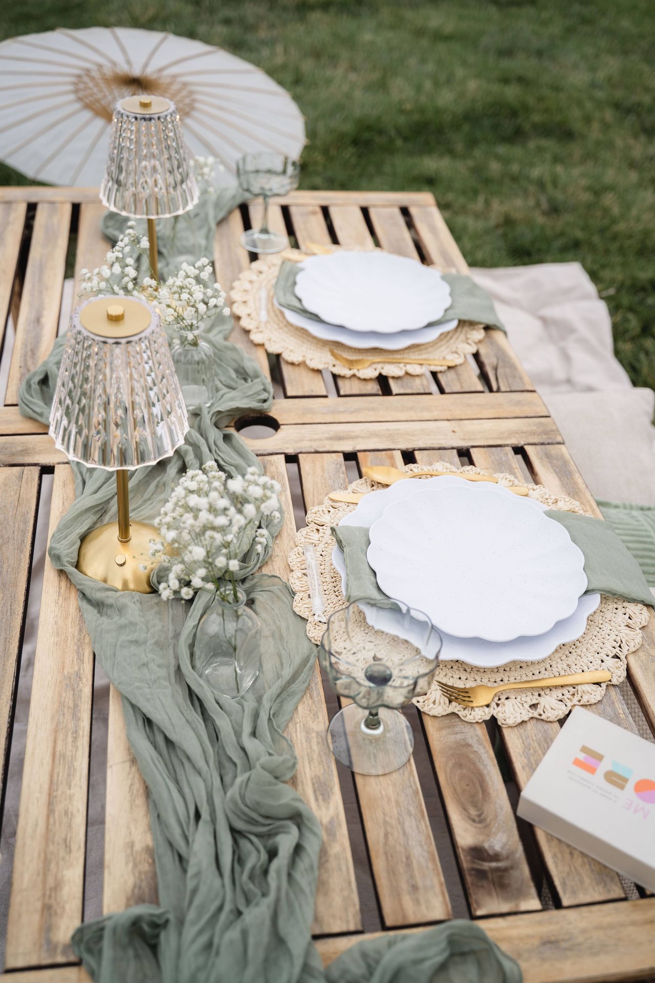 picnic table with table lamp, baby breath flowers, and tableware in Denver, Colorado