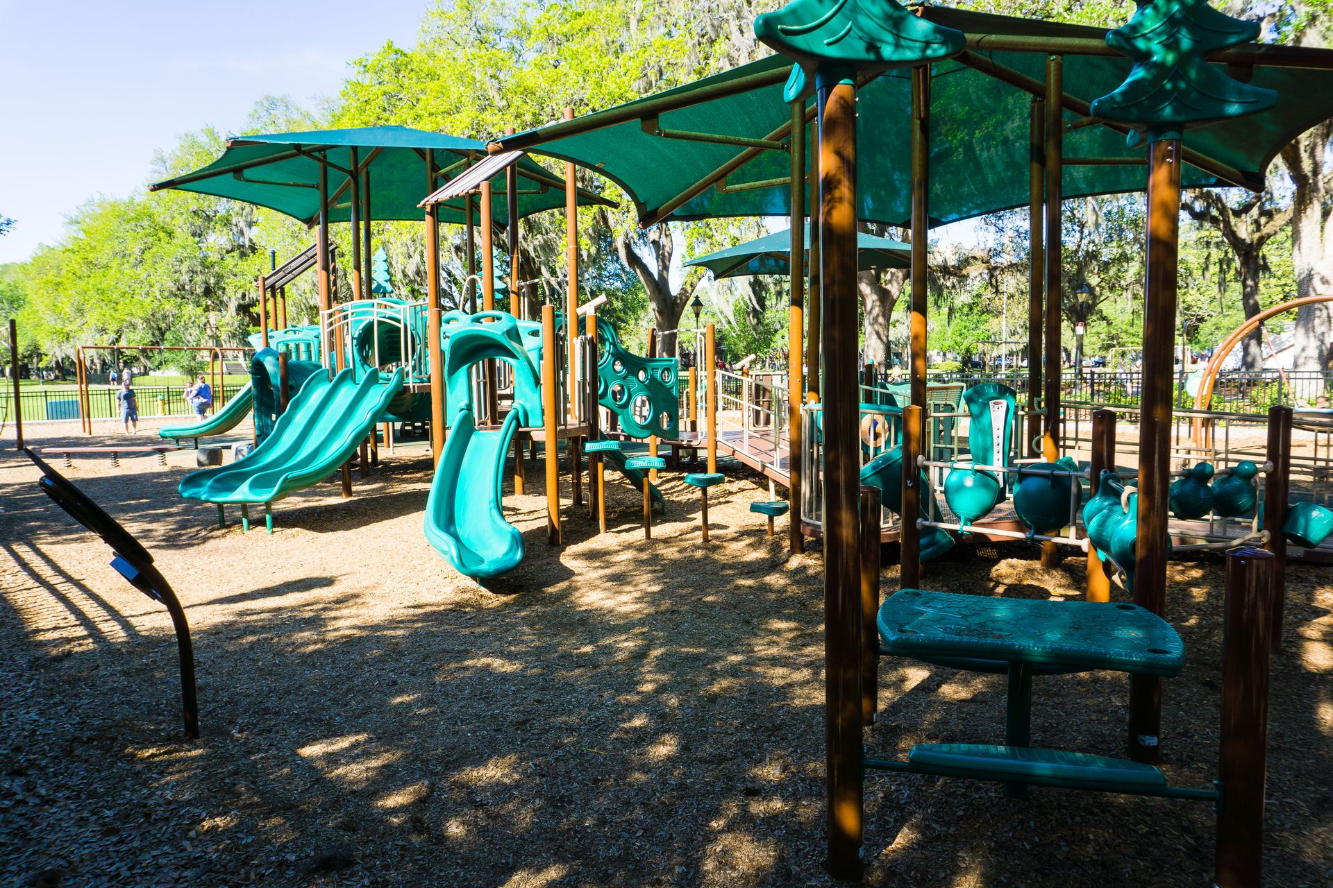 Family playing at Forsyth Park Playground Savannah Family playing at Forsyth Park Playground Savannah