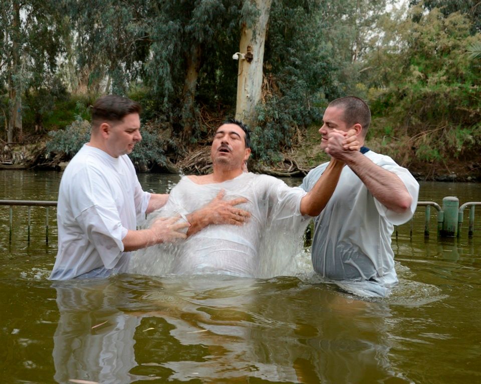 Young woman baptized in the ocean Young woman baptized in the ocean