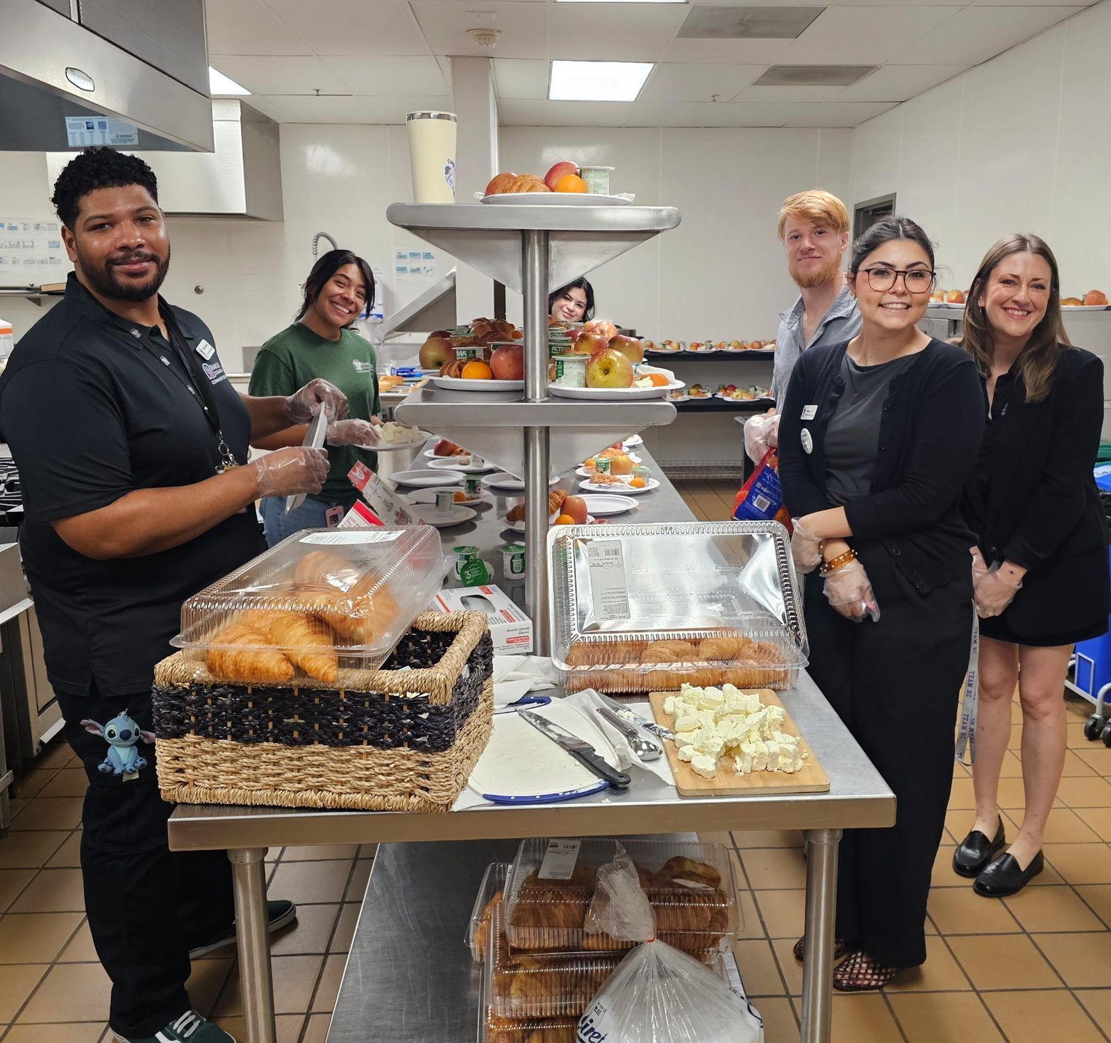 Rancho Cucamonga staff preparing breakfast in the kitchen for Senior Month Rancho Cucamonga staff preparing breakfast in the kitchen for Senior Month