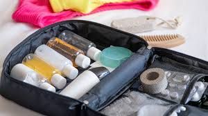 Open travel toiletry bag with organized bottles and essentials