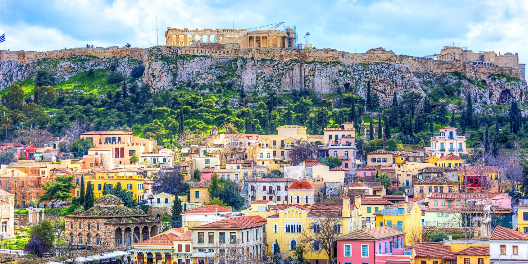Colorful Plaka neighborhood beneath the Acropolis in Athens.