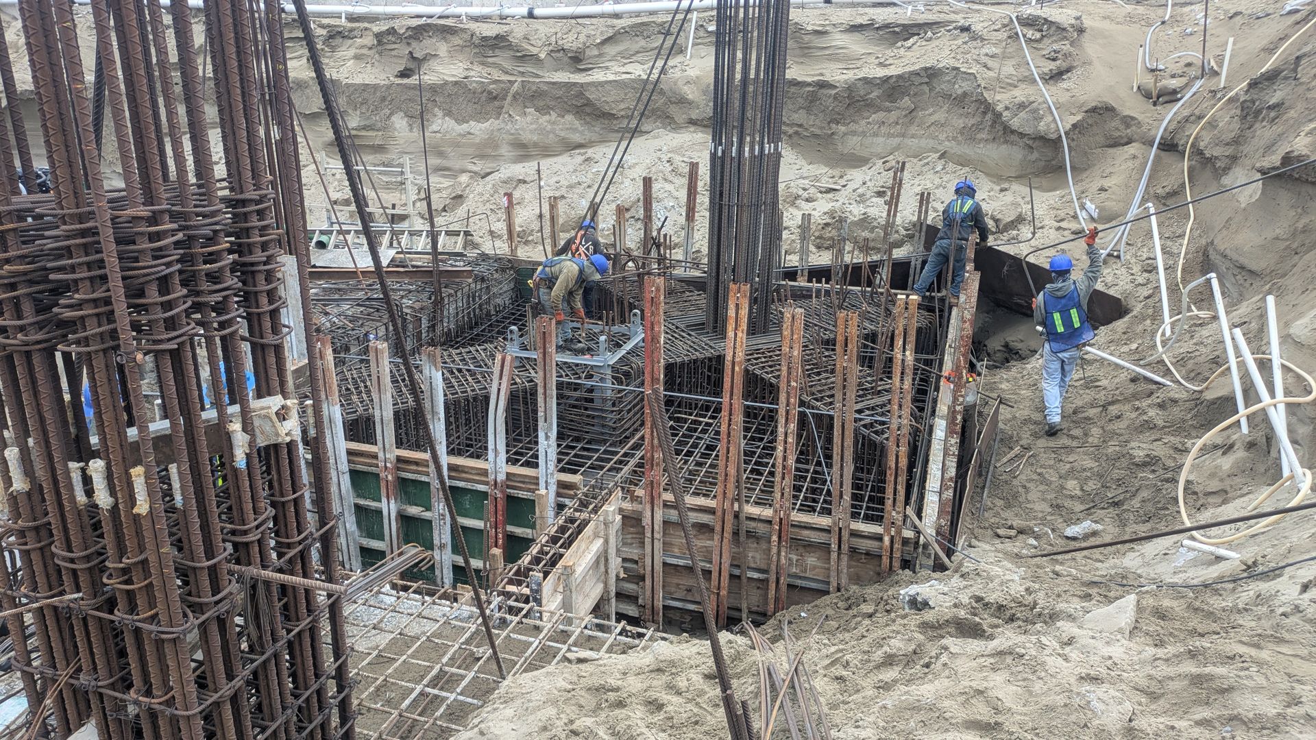 excavators and truck working in construction site excavators and truck working in construction site