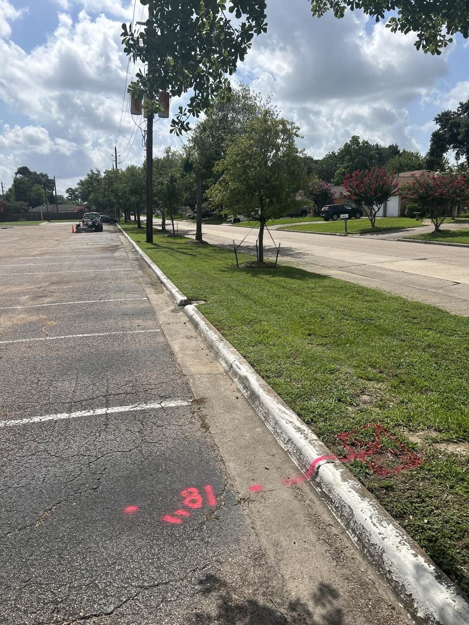 Color-coded utility locate paint marks on pavement Color-coded utility locate paint marks on pavement