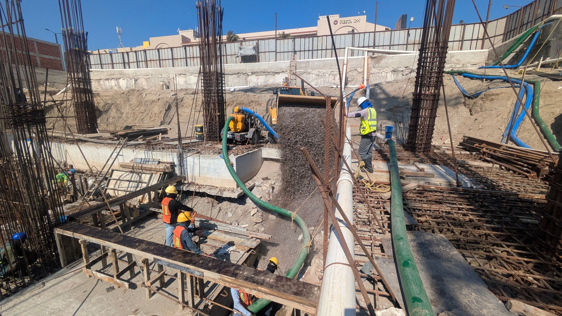 excavators and truck working in construction site excavators and truck working in construction site