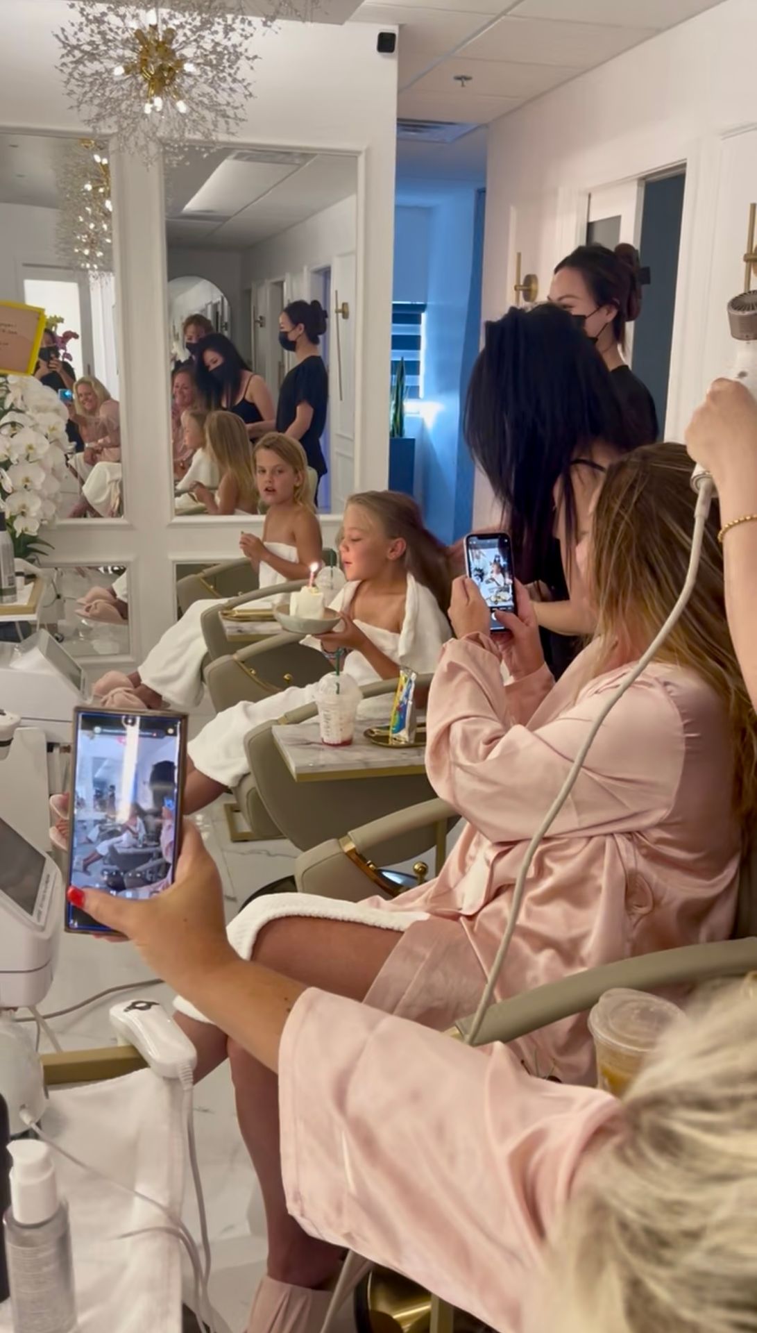a group of friends and daughters celebrating a birthday at a local head spa in Artesia CA a group of friends and daughters celebrating a birthday at a local head spa in Artesia CA