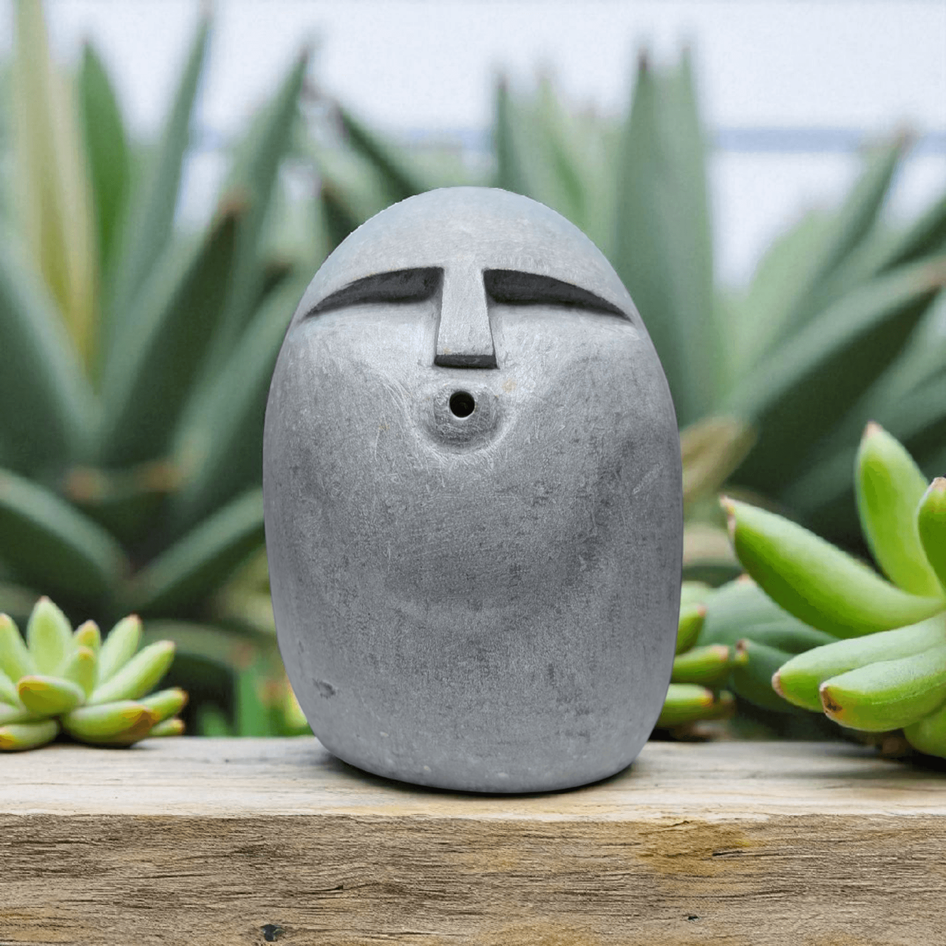 Stone Ooof face carving 