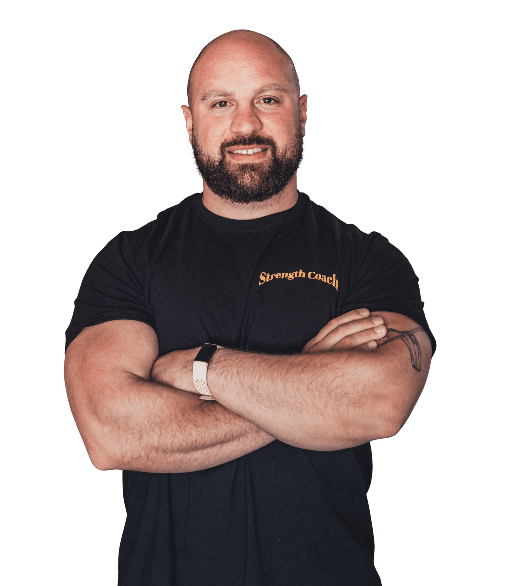 Bald man with a beard crosses arms, wearing a black shirt labeled 'Strength Coach'.