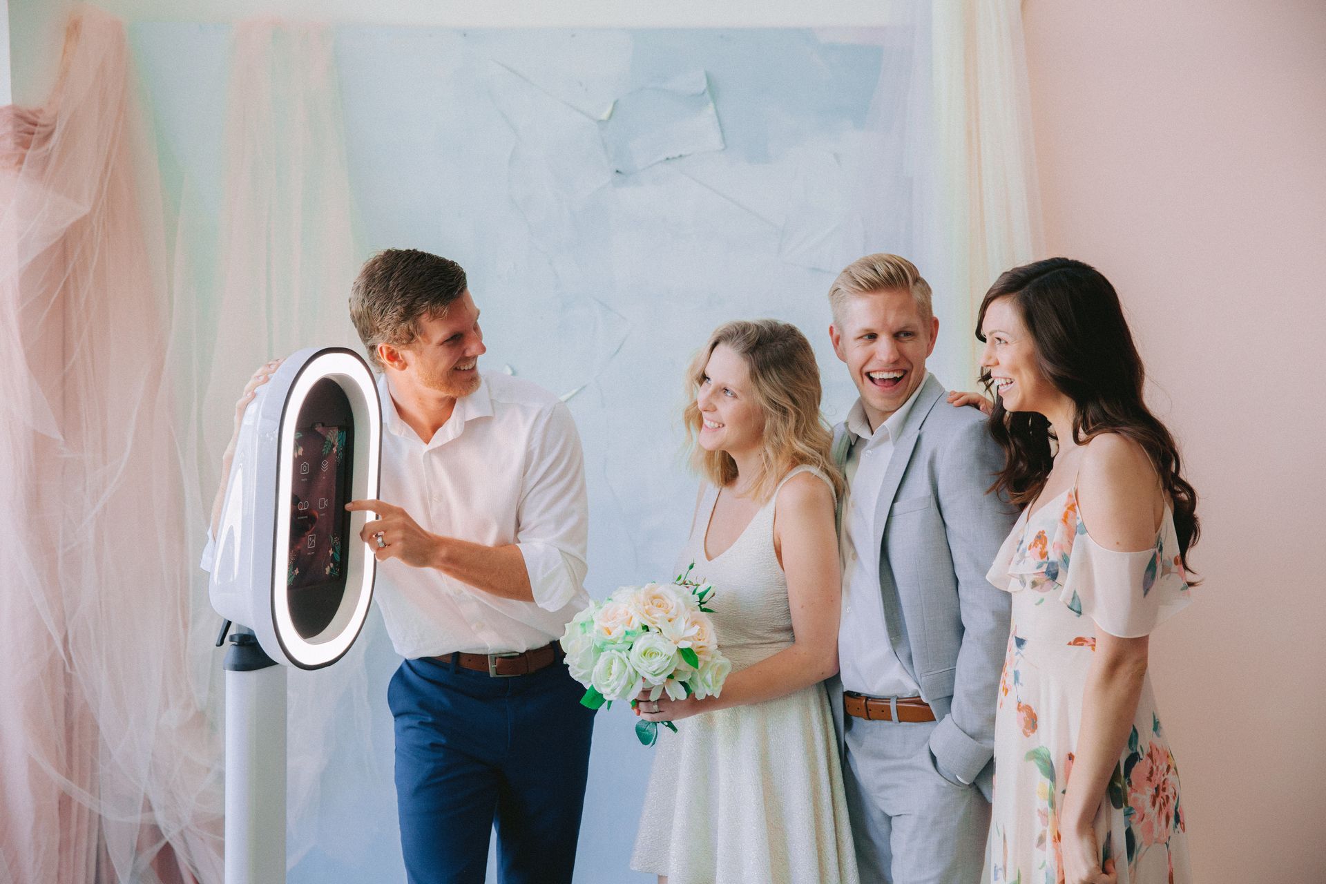 Happy bride with guests at a wedding reception