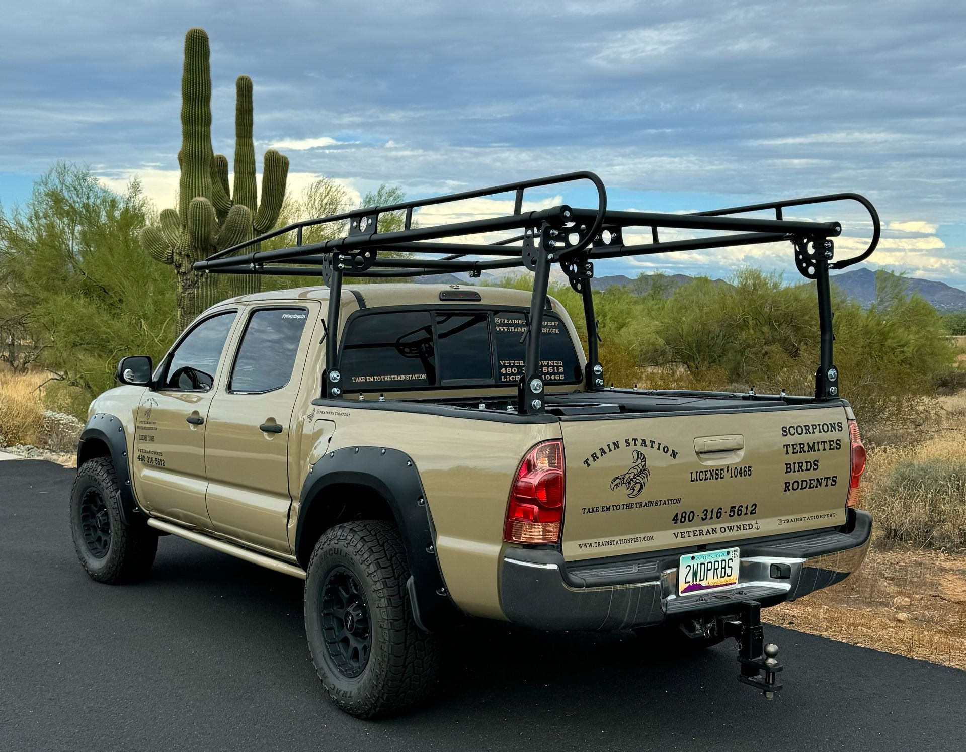 Phoenix Veteran-Owned Train Section Pest Elimination Work Vehicle - Desert Sand Toyota Extra Cab with ladder rack Phoenix Veteran-Owned Train Section Pest Elimination Work Vehicle - Desert Sand Toyota Extra Cab with ladder rack