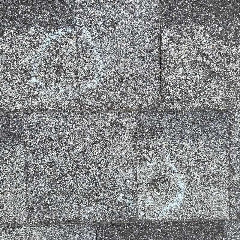 Two hail hits circled in chalk