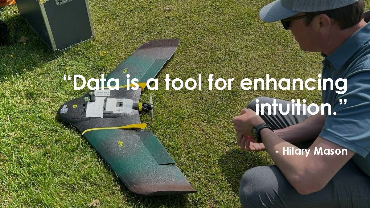 Image of Jeffrey Danner observing a survey drone with Hilary Mason's quote 