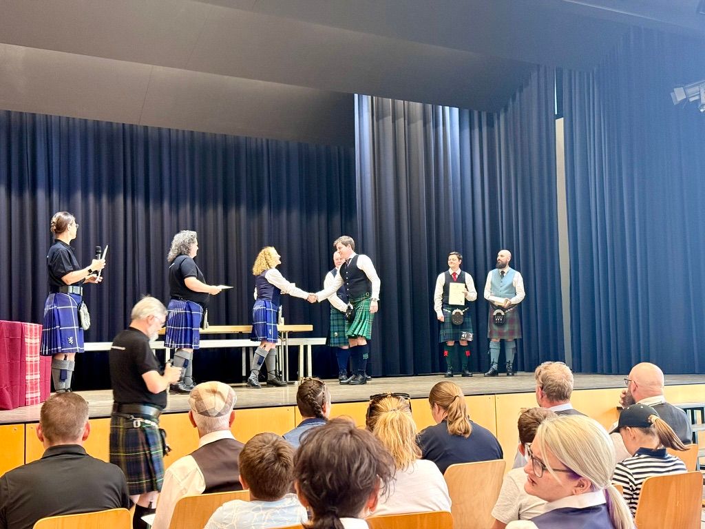 Swiss Piping Champion Yann Le Mouel receiving first prize at the Swiss Piping Championship in St. Gallen, Switzerland