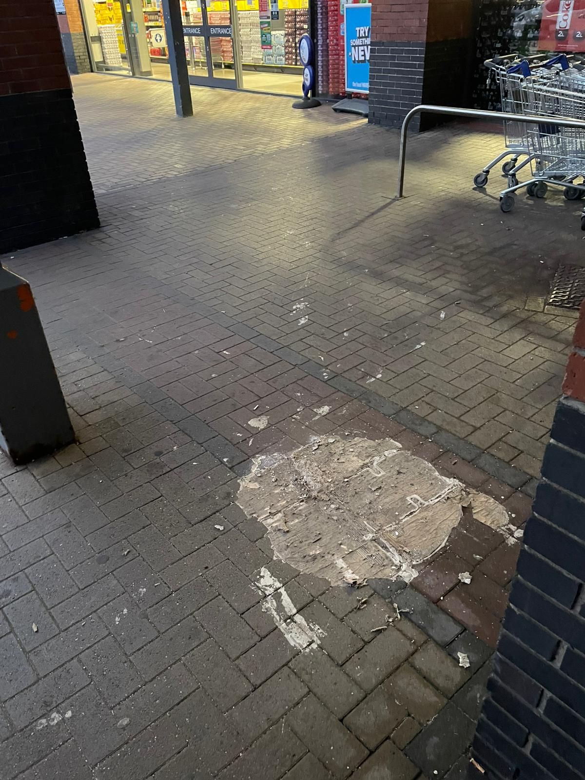 Picture of a paint spillage on block paving on a Retail park in Leeds, LS11