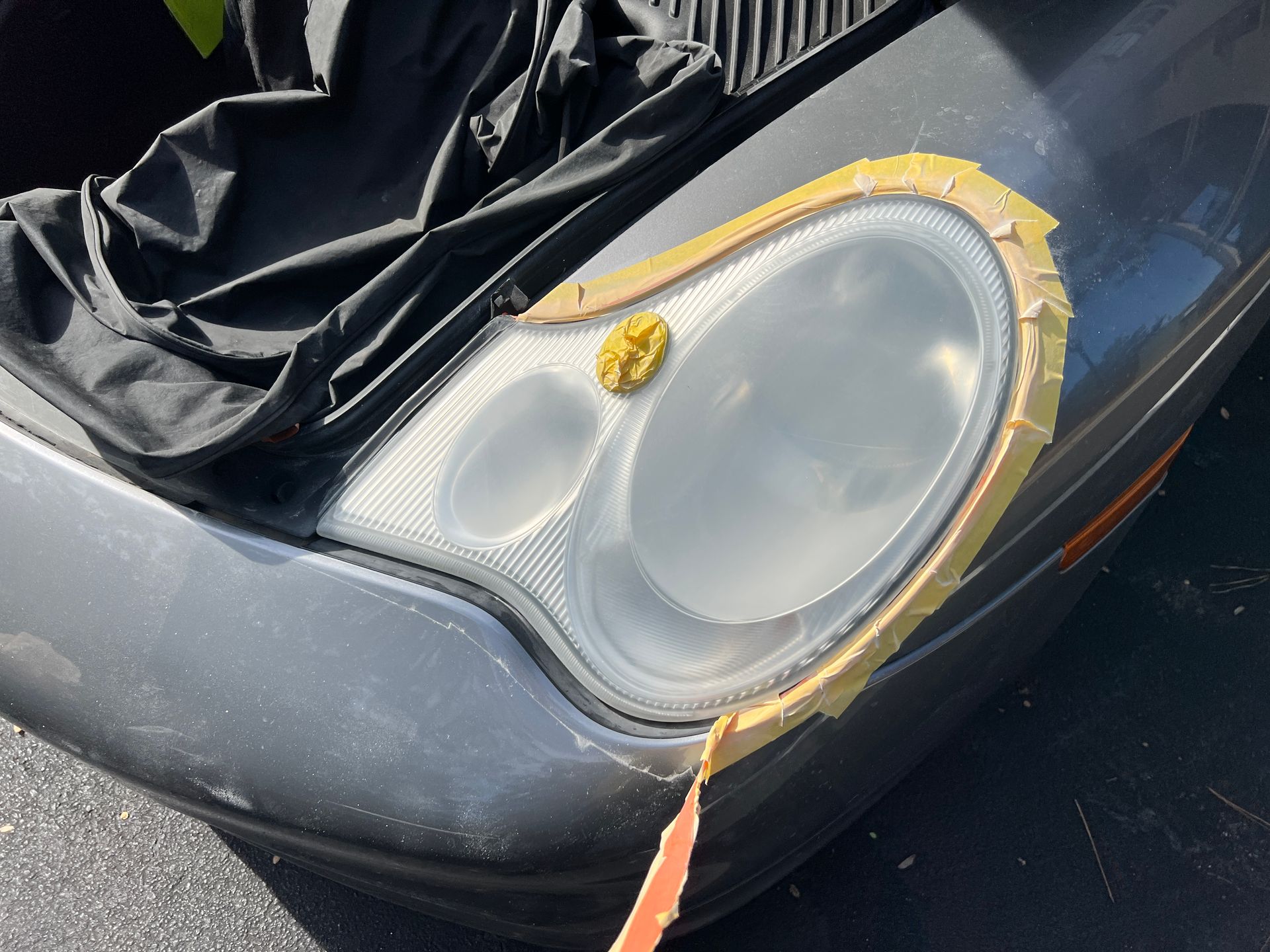 Removing Tape from Sanded Porsche Headlight