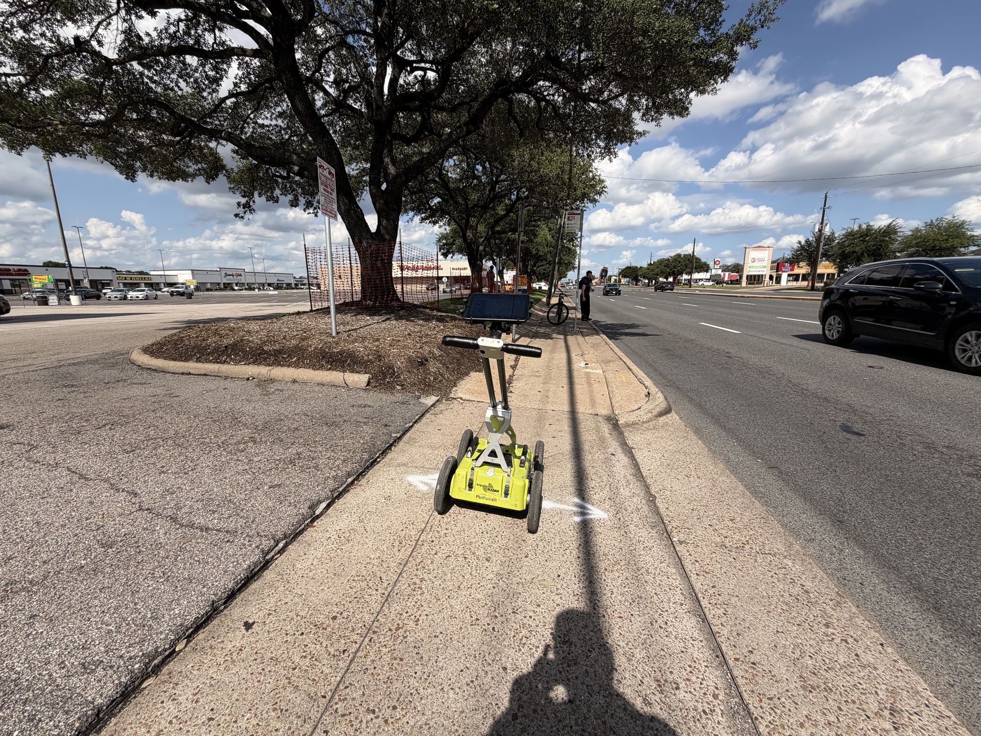 GPR scanning technician mapping buried utilities on a Fort Worth, Texas jobsite before excavation