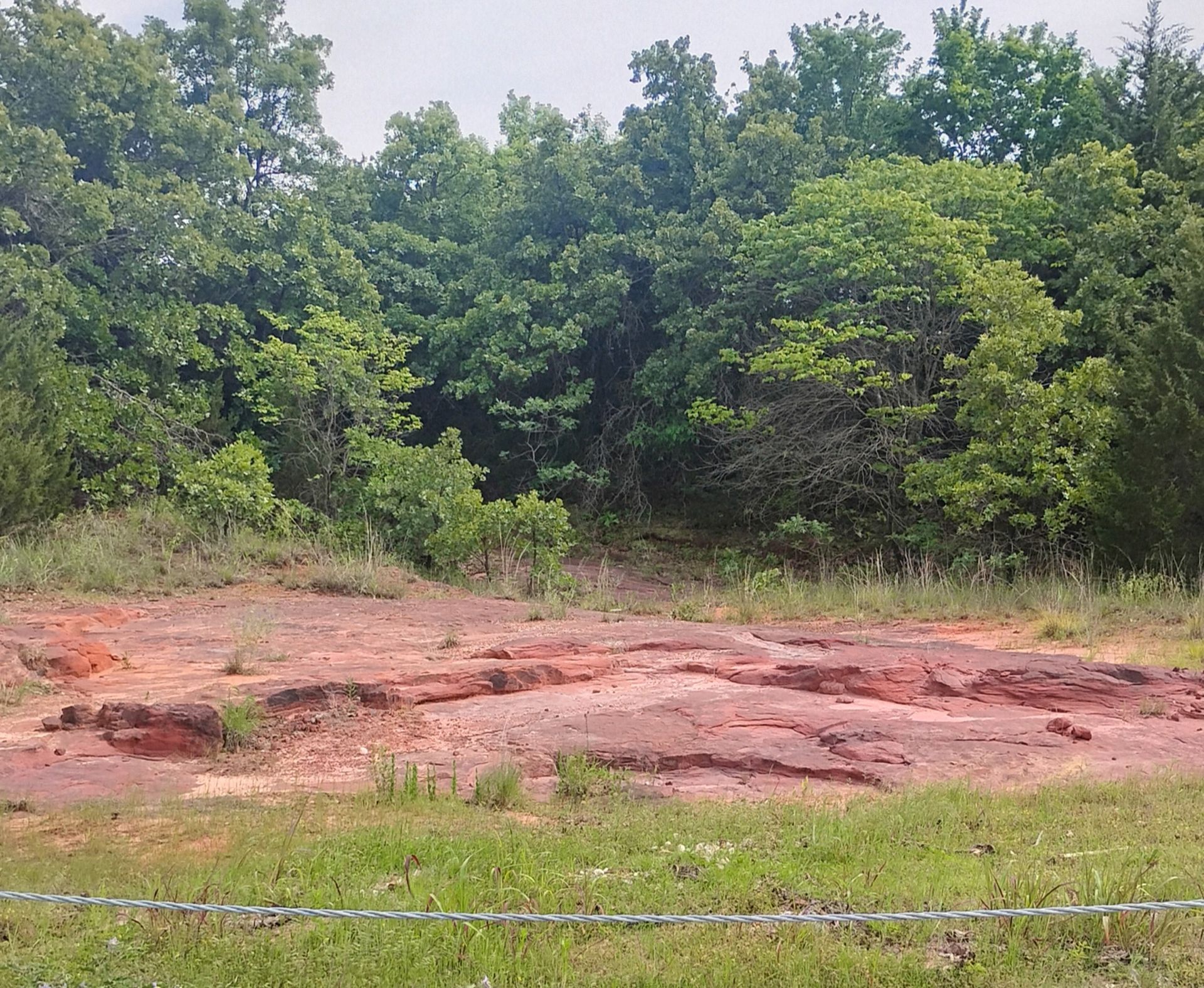 A large red sandstone outcropping in Oklahoma A large red sandstone outcropping in Oklahoma