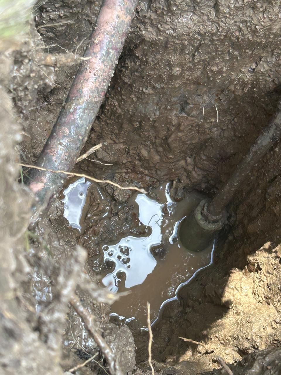 Potholing exposes a buried utility line to verify depth and location before excavation