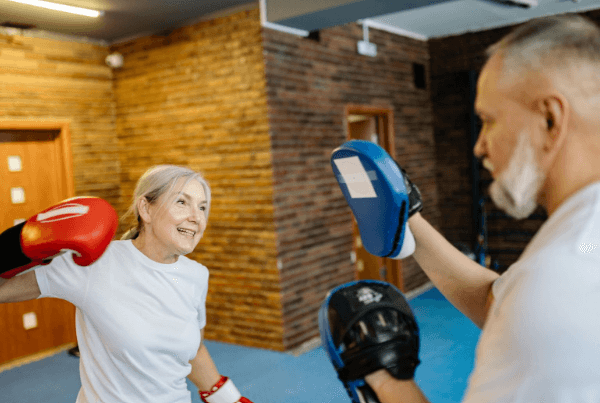 Older woman with red boxing glove