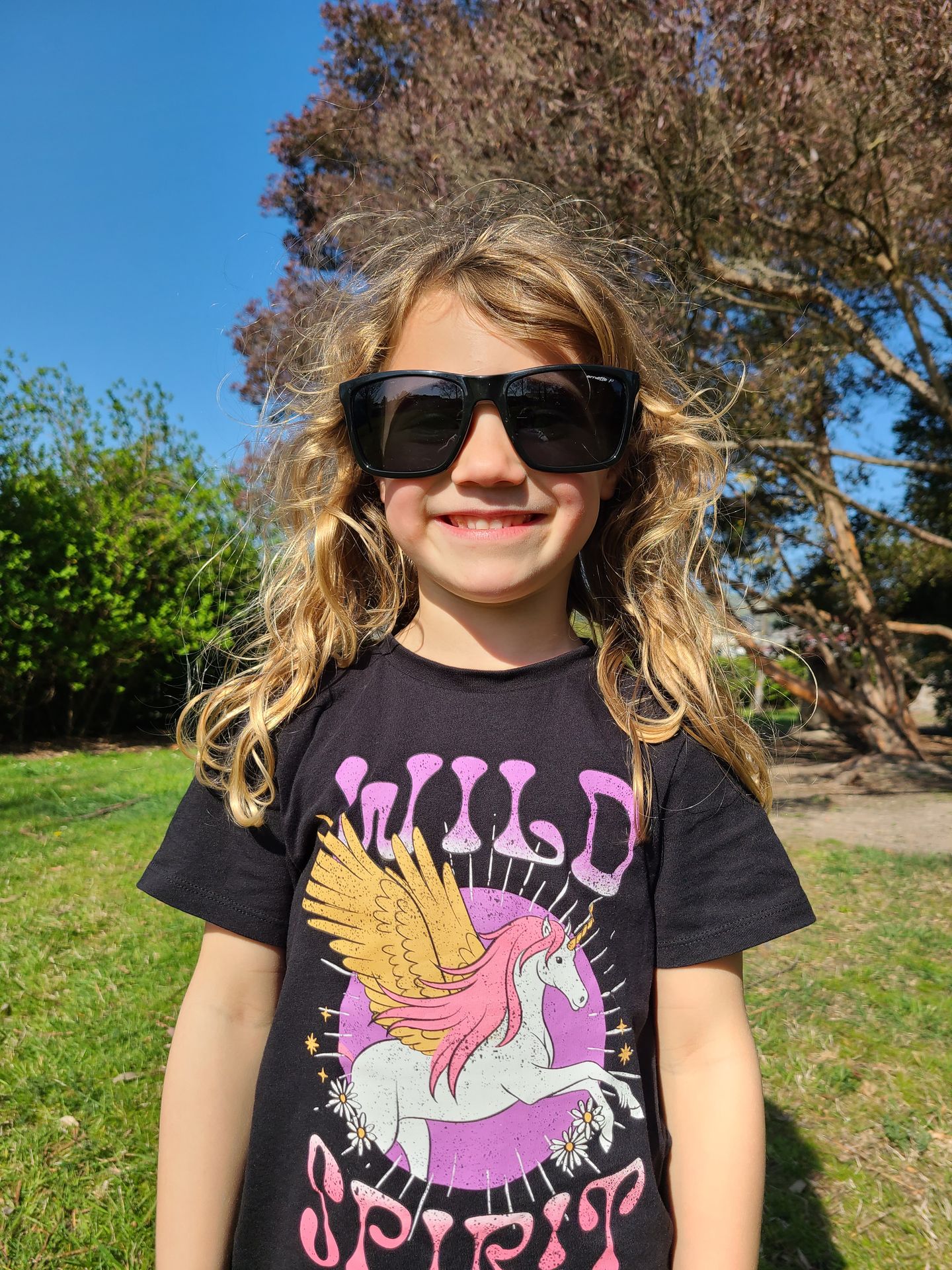 Young girl wearing"wild spirit" t-shirt