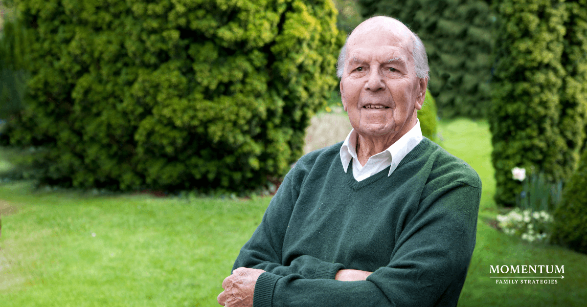 man in black vest and black dress pants standing beside white wooden door man in black vest and black dress pants standing beside white wooden door