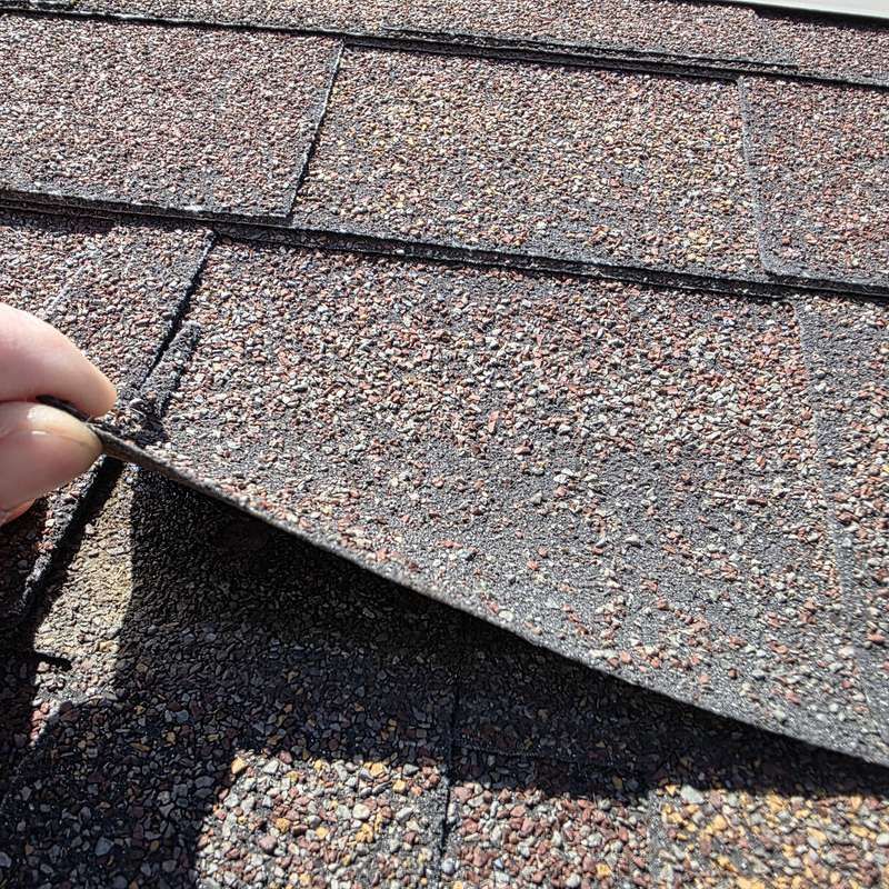 Unsealed shingle lifting by hand