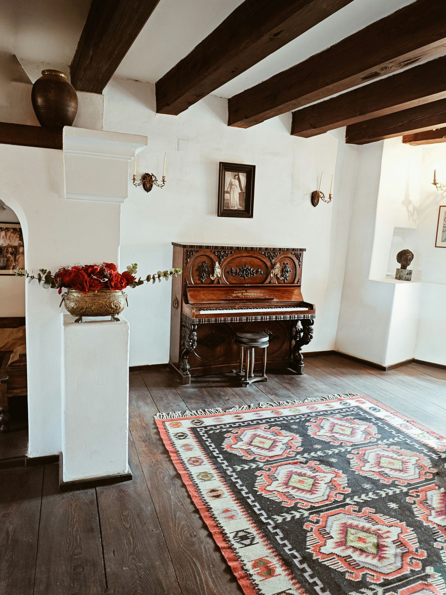 clean and cleared off upright piano in a living room clean and cleared off upright piano in a living room