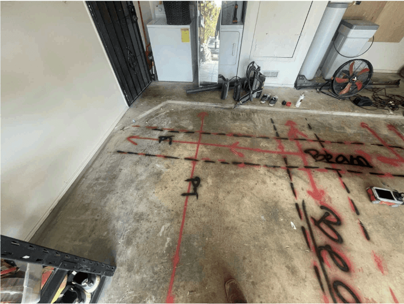 GPR scan markings laid out in red across an interior concrete slab before coring GPR scan markings laid out in red across an interior concrete slab before coring