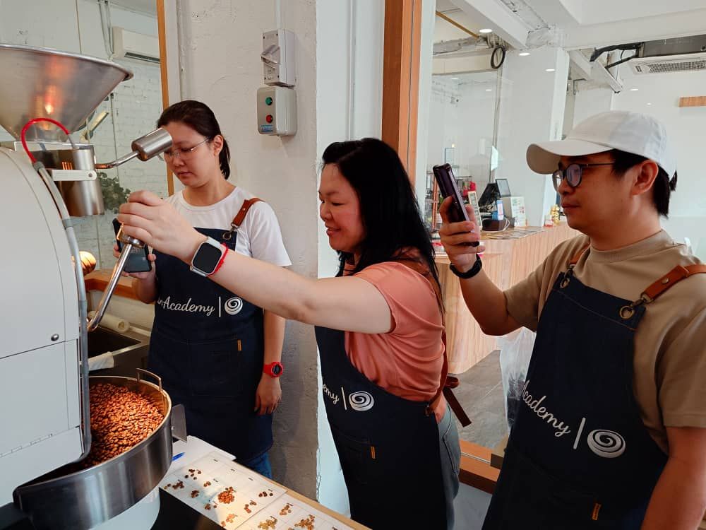 Coffee roasting practical for SIP trainees at CAN Academy Klang monitoring bean color