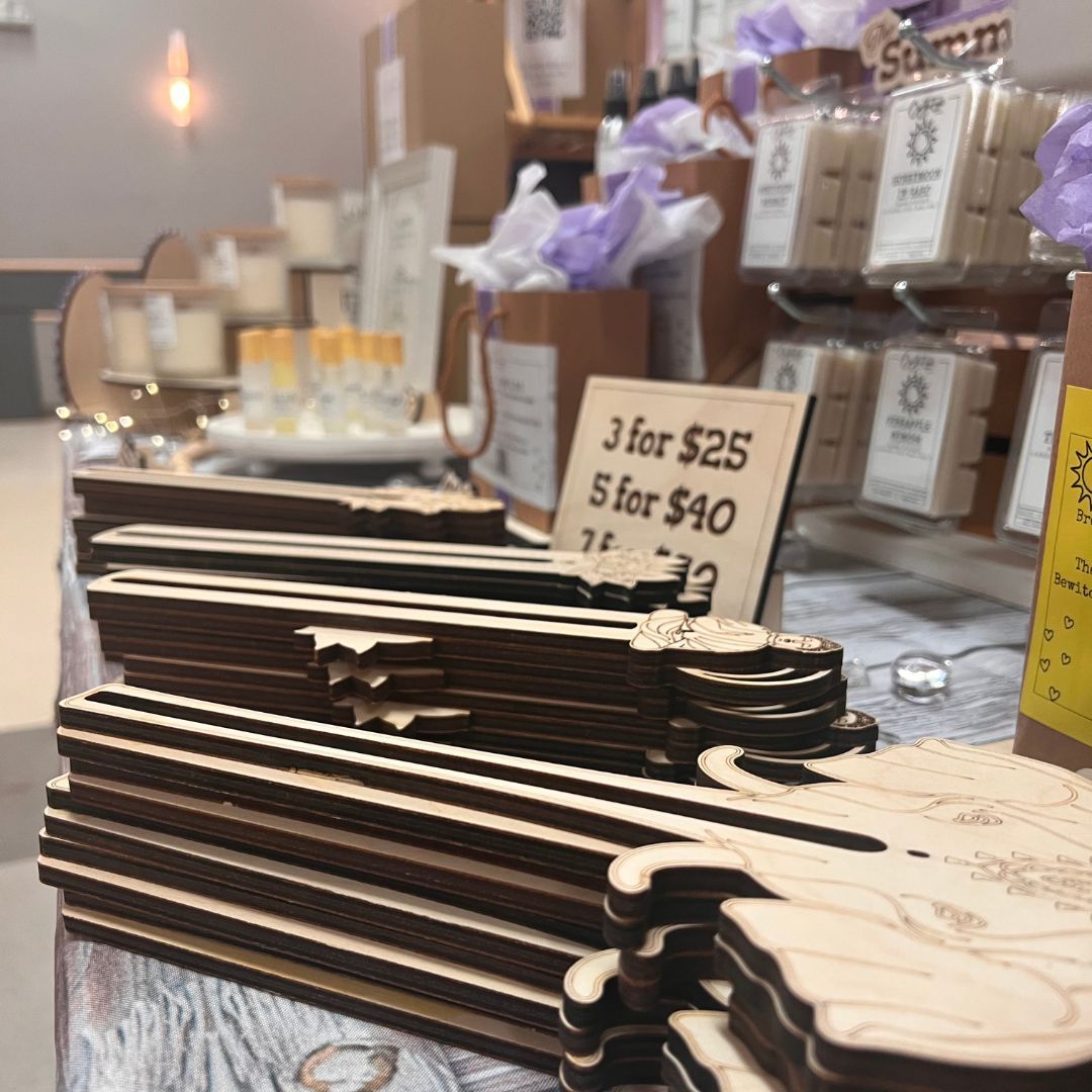 Indoor festive weekend market. Social pop up event of entrepreneurs and makers selling their goods at their booths in shopping mall. Captured with a tilt-shift lens. Selective focus; bokeh effect Indoor festive weekend market. Social pop up event of entrepreneurs and makers selling their goods at their booths in shopping mall. Captured with a tilt-shift lens. Selective focus; bokeh effect