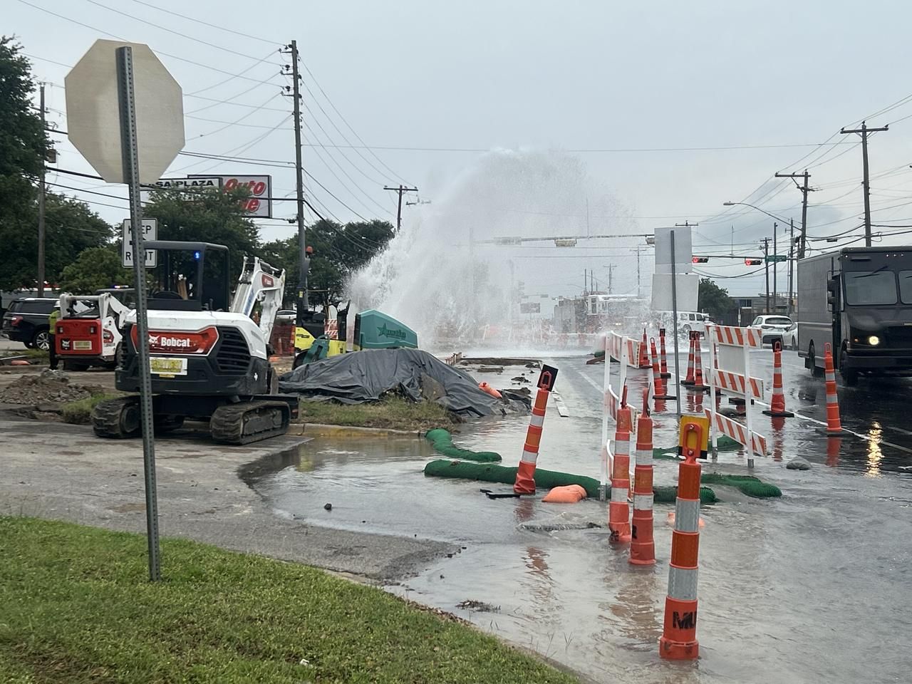 Water main break showing the cost of an underground utility strike Water main break showing the cost of an underground utility strike
