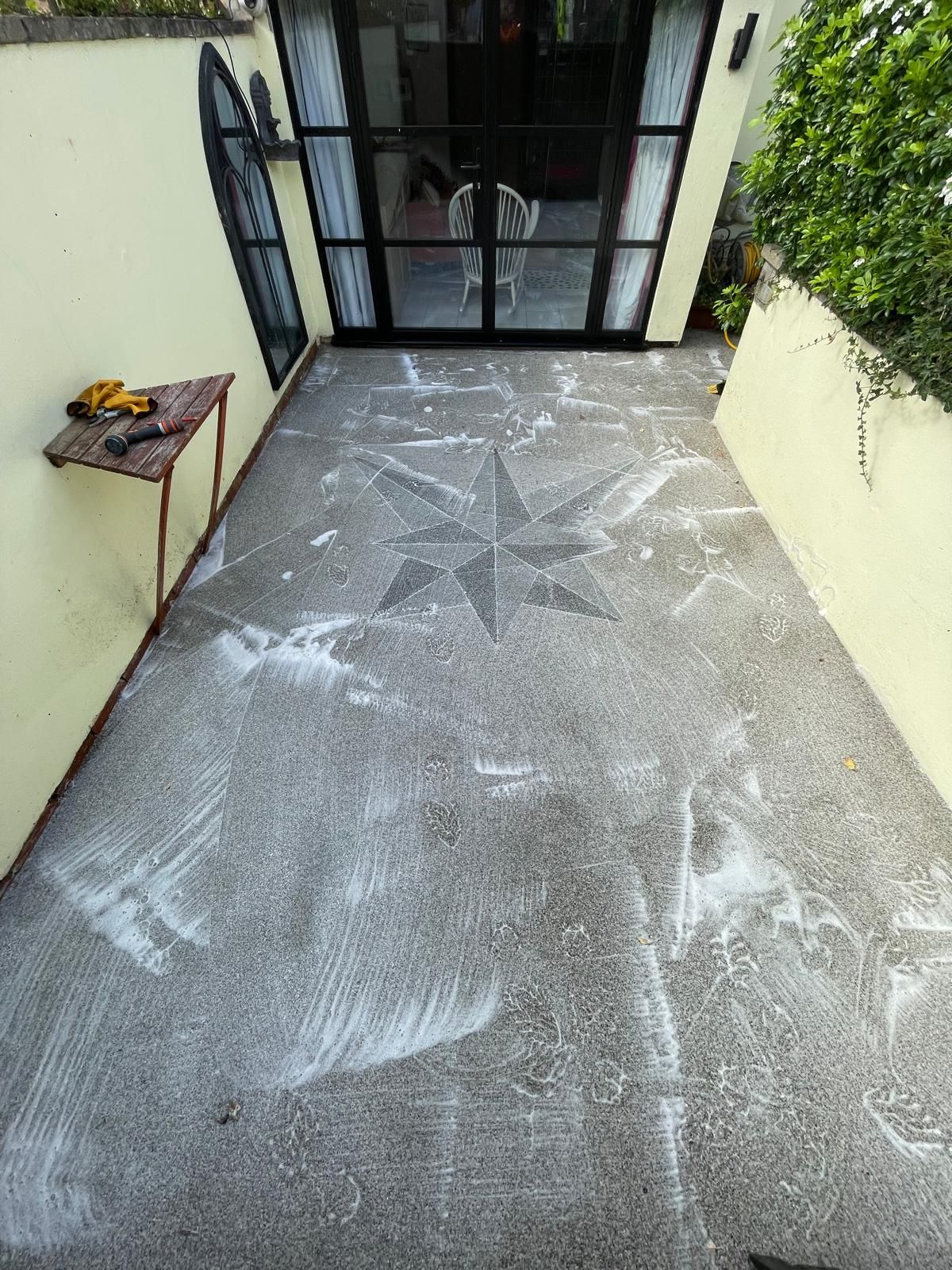Resin Bound driveway during cleaning with cleaning agent on Resin Bound driveway during cleaning with cleaning agent on